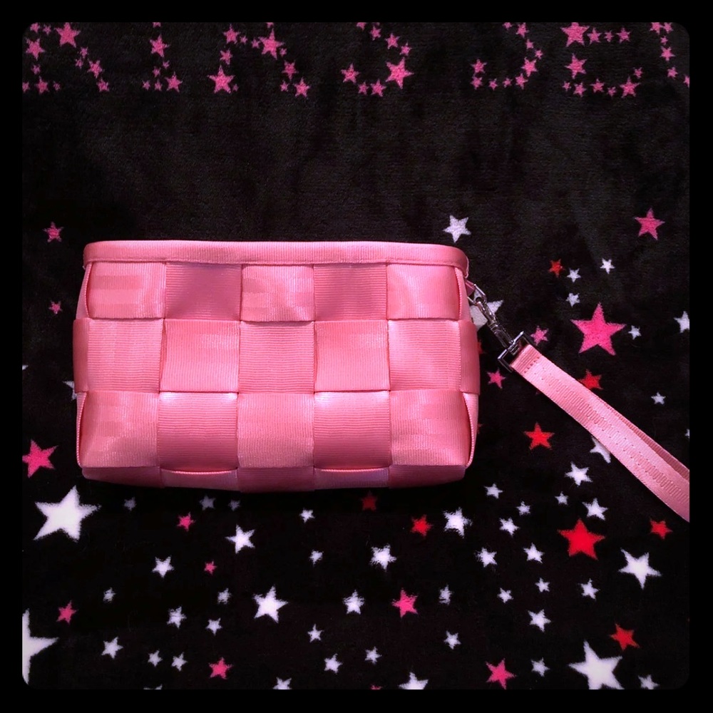 Harveys seatbelt pink clutch with wrist strap
